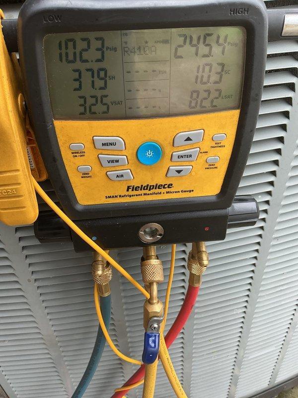 Churubusco, IN - Completed scheduled AC tune-up and cooling system evaluation. Connected refrigerant manifold gauges to measure system pressures and temperatures, recording low-side pressure at 102.3 psig with 378°F superheat and high-side pressure at 245.4 psig with 10.3°F subcooling. System operating parameters indicate proper refrigerant charge and adequate cooling performance for seasonal operation.