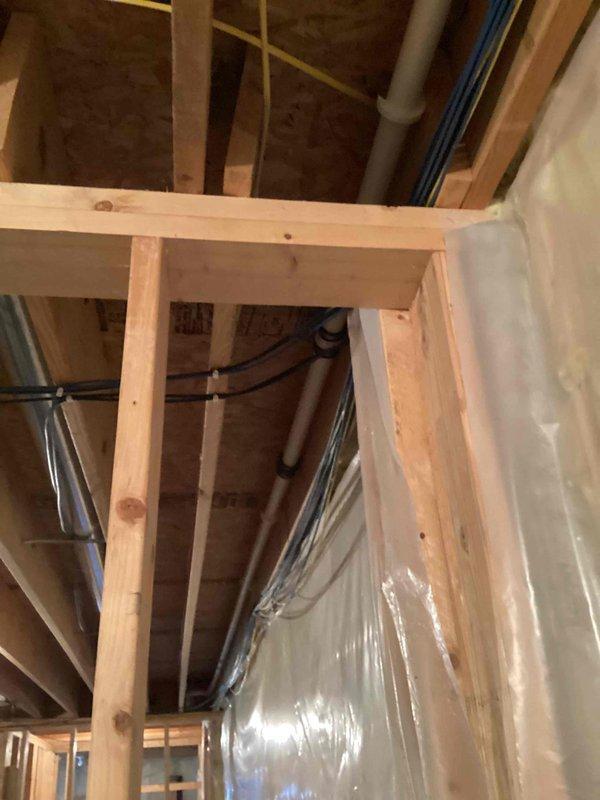 Completed installation of WaterFurnace W5AV042BD1A12NTR2B01 3.5-ton, 2-stage variable speed 5 Series geothermal heat pump system with IntelliStart technology and cupronickel water coil for enhanced mineral resistance. Integrated EAL10 10KW electric backup heat internally within unit cabinet, WWK2T well water kit featuring slow-closing solenoid valve for water hammer prevention, FRHY flow regulator, and TPCM32U04A communicating digital programmable thermostat for system control.

Installed I-WAVE R air purification system and dual 50-gallon electric water heaters with desuperheater integration for domestic hot water preheating. Connected unit to existing open-loop well water piping system and performed necessary modifications to existing ductwork to ensure proper airflow distribution throughout the structure.

Completed all high and low voltage electrical connections between the geothermal unit, thermostat, and system controls. Reconnected desuperheater to water heating system for energ