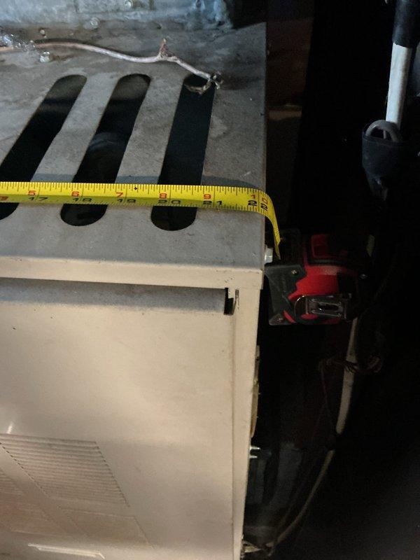 Conducted on-site assessment for complete oil furnace and air conditioning system replacement in basement. Evaluated existing 25+ year-old oil-fired heating equipment and associated ductwork for removal and replacement specifications. Documented current system configuration including furnace dimensions, clearances, and existing duct connections. Assessed fuel oil tank situation and provided guidance regarding fuel removal requirements prior to equipment replacement, clarifying that customer is responsible for arranging fuel oil pump-out service before installation can proceed.