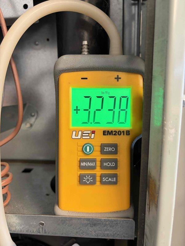 Performed second opinion inspection on gas furnace following previous contractor's diagnosis of cracked heat exchanger. Conducted comprehensive system evaluation including visual inspection of heat exchanger, burner operation analysis, and pressure differential testing using digital manometer which measured +32.38 InWg. Observed all three burner assemblies firing with proper blue flame characteristics and normal combustion patterns. Documented findings with photographic evidence of burner operation and diagnostic measurements for customer review. Coordinated with sales representative for equipment replacement consultation.