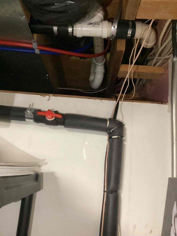 Responded to water leak emergency involving frozen and burst exterior hose bibb and leaking shower valve. Accessed shower plumbing through drywall removal to expose damaged copper supply lines and valve assembly. Replaced compromised piping section with new copper pipe and fittings, installed new shower valve cartridge, and verified proper water flow and shut-off functionality. Replaced frozen exterior faucet with freeze-resistant hose bibb rated for cold climate conditions. Inspected under-sink plumbing connections during service call, confirmed PVC drain assembly and hot/cold supply lines with shut-off valves were secure and functioning properly. Tested all repaired fixtures for leaks, verified proper water pressure, and confirmed no additional moisture damage to surrounding areas.