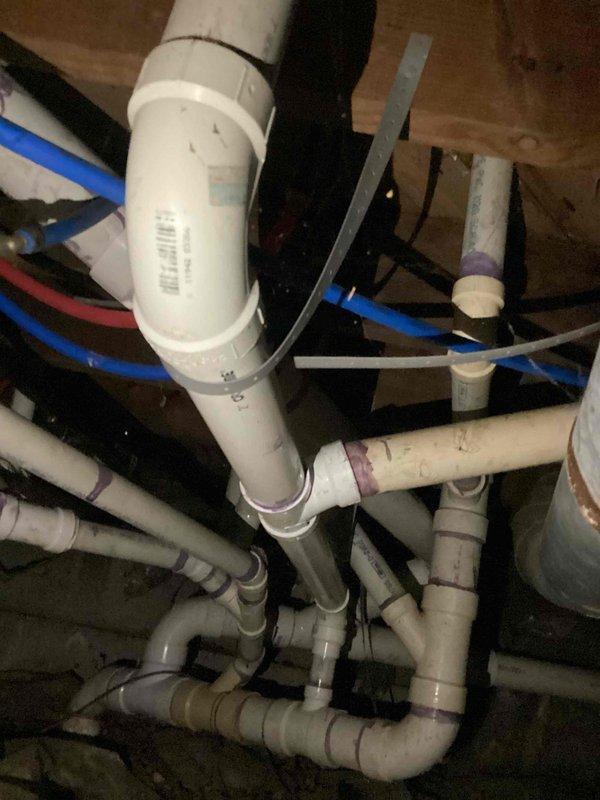 Provided estimate for converting existing bathroom to bedroom, requiring capping and sealing all plumbing supply lines and drain connections in crawl space. Assessed existing PVC drain system and PEX water supply lines serving bathtub/shower combination unit for proper abandonment procedures. Additional estimate requested for relocating washer and dryer hookups to alternate location within the structure.