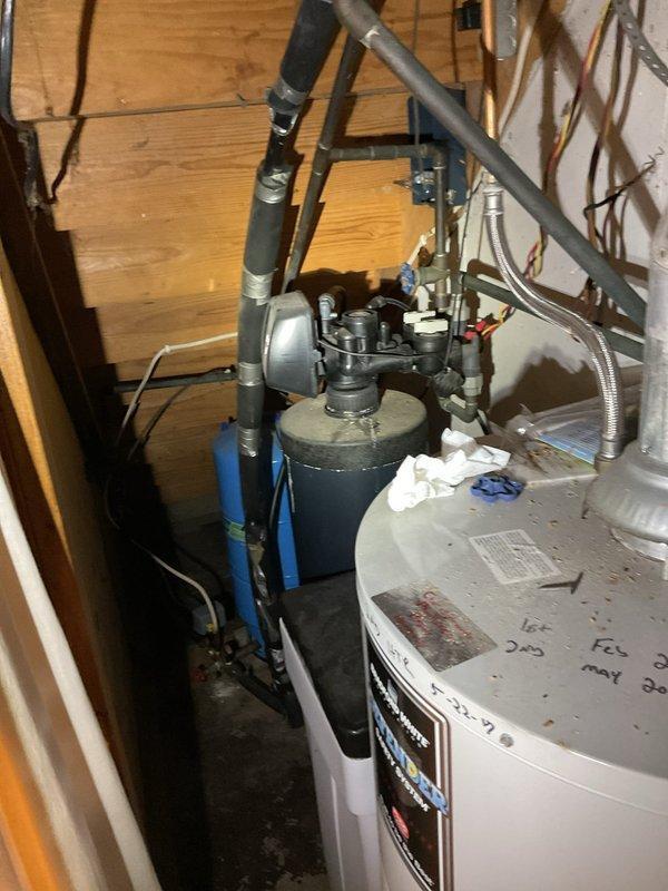 Performed comprehensive tanked water heater maintenance flush on dual water heater system installed in basement utility area. Drained sediment and mineral buildup from both tanks through drain valves to improve heating efficiency and extend equipment lifespan. Inspected all plumbing connections, including copper supply lines, shut-off valves, pressure relief valves, and flexible connectors for proper operation and signs of corrosion or wear. Verified pressure tank functionality and checked all brass fittings for leaks. Refilled water heaters and tested for proper operation following flush procedure. All components functioning within normal parameters upon completion.