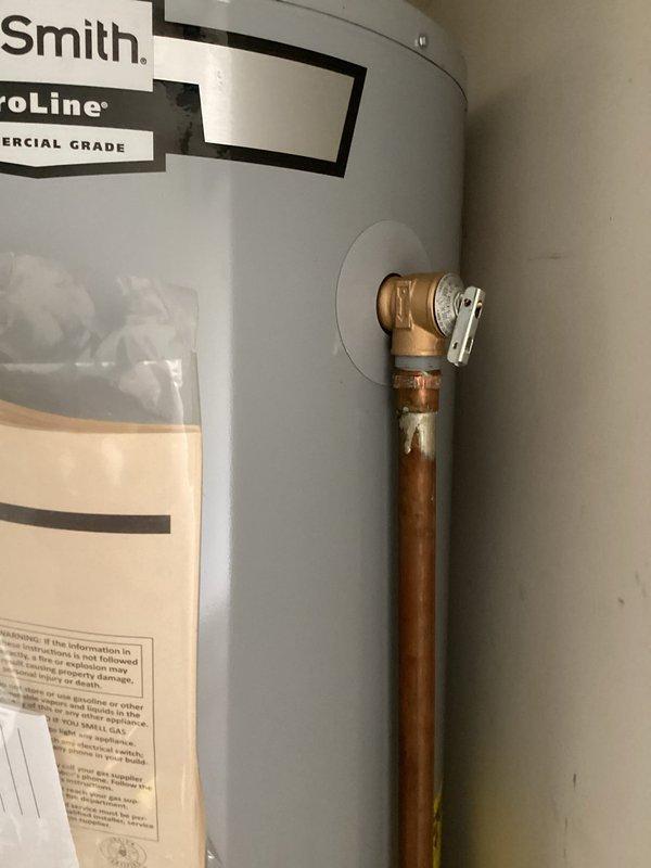 Responded to callback for leaking temperature and pressure relief valve on commercial-grade A.O. Smith ProLine water heater following previous day's maintenance service. Inspected relief valve discharge and confirmed slow leak from valve body. Replaced defective T&P relief valve with new unit, tested operation and discharge function, and verified proper seating with no leakage detected upon completion.