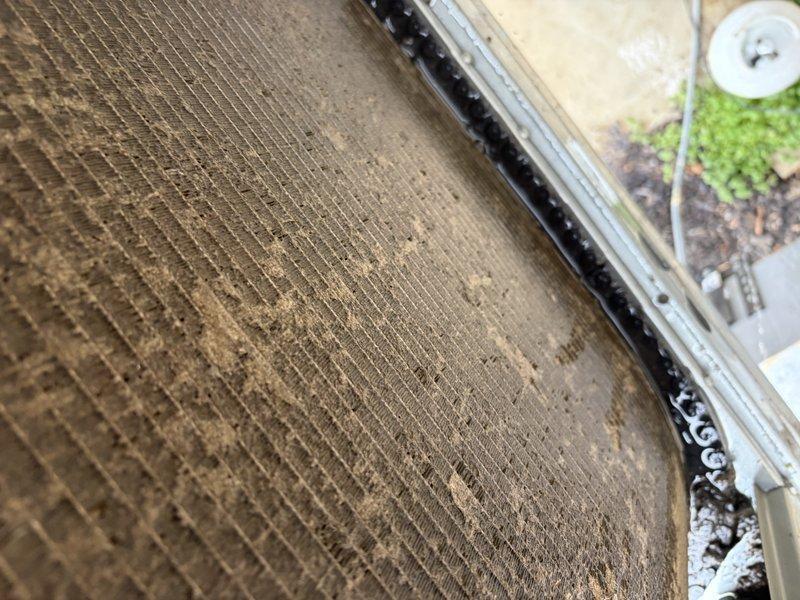 # HVAC Service - No Cool 10+ Years Old

Responded to service call for downstairs unit not cooling. Upon arrival, performed system inspection to diagnose cooling failure. Found heavily contaminated evaporator coil with significant accumulation of dust, dirt, and debris throughout the fin structure. The buildup was restricting proper airflow across the coil, severely impacting heat transfer efficiency and cooling capacity.

Inspected air filtration system and discovered dirty pleated air filter in return air plenum. The filter media showed substantial particulate loading, indicating extended service interval and contributing to reduced system airflow and coil contamination. Restricted airflow from the clogged filter was a primary factor in the no-cooling condition.

Recommended thorough coil cleaning to restore proper heat transfer and system efficiency. Advised replacement of air filter with appropriate MERV-rated filter and discussed importance of regular filter maintenance schedule to