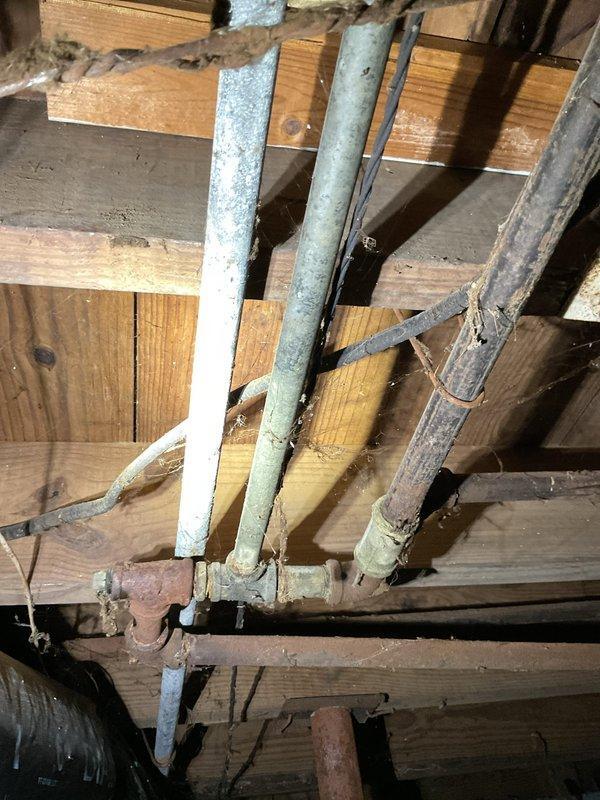 Provided estimate for replacement of existing gas-fired tank-type water heater located in basement. Unit assessed with visible aging, moisture staining on floor beneath unit, and standard venting configuration through existing galvanized ductwork. Scope includes removal and disposal of old water heater, installation of new gas tank water heater utilizing existing gas line connections and plumbing infrastructure, and verification of proper venting and code compliance.