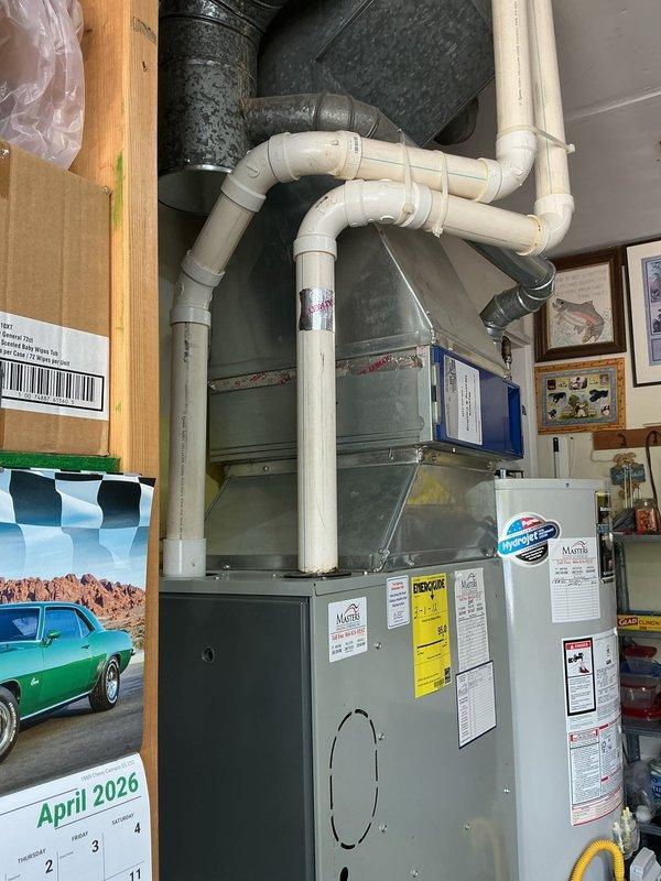 Responded to no-cooling complaint on 15-year-old residential HVAC system. Diagnostic inspection revealed leaking evaporator coil and failed thermostatic expansion valve (TXV). Due to age of equipment and extent of necessary repairs, provided comprehensive replacement estimate as alternative to repair quote. Documented existing furnace and air handler installation in basement mechanical room with photographs showing current system configuration, including PVC condensate drainage and ductwork connections. Coordinated with team regarding repair versus replacement options for customer consideration. Estimate includes new maintenance plan enrollment as requested.